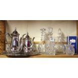 Three cut crystal decanters, two other crystal items and a silver plated tea set.