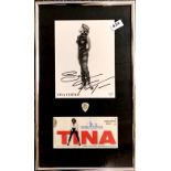 A framed signed photograph of Tina Turner, with a July 2000 ticket, program and t-shirt.