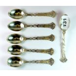 A set of six hallmarked silver George V teaspoons, with pierced handles, makers mark worn, London c.