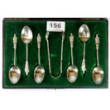 A set of six hallmarked silver Apostle teaspoons together with a matching pair of sugar tongs, T H