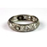 A white metal (tested platinum) filigree diamond set full eternity ring (P.5).