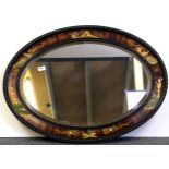 A 1920's chinoiserie decorated oval hanging wall mirror, W. 87cm H. 63cm.