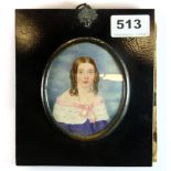A mid 19th century watercolour on ivory miniature portrait of a young girl, in a black lacquered