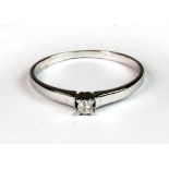 An 18ct white gold (stamped 18ct) diamond solitaire ring (U).