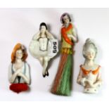 Three porcelain half dolls and a porcelain novelty ashtray.