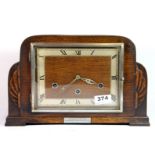 An Art Deco chiming oak mantle clock, W. 33cm.