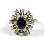 An 18ct white gold (stamped 18ct) sapphire and diamond set ring (L.5).