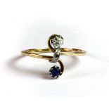 A 14ct yellow gold (stamped 585) diamond and sapphire set ring (O).