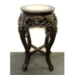 A 19th century Chinese carved hardwood plant stand with inset marble top, H. 60cm.