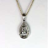 A white metal pendant set with a lovely centre trillion shaped rose cut diamond surrounded by