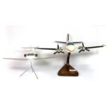 A wooden desk model Piper aircraft, Cheyenne, together with a desk model of a jet aircraft, L.