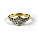 An 18ct yellow gold and platinum (stamped 18ct & plat) diamond cluster ring (N.5).