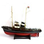 A large painted plastic model of a tug boat, L. 82cm.