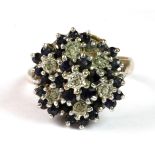 A 9ct yellow and white gold diamond and sapphire cluster ring (L.5).