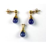 A pair of 18ct yellow gold (worn mark 750) drop earrings and matching pendant set with tanzanites,