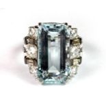 An 18ct white gold (stamped 750) ring set with a lovely emerald cut aquamarine (approx. 11ct),