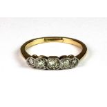 An 18ct yellow gold and platinum (stamped 18ct & plat) diamond set ring (M).