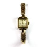 A lady's 9ct gold vintage Omega wrist watch with 9ct gold expanding strap.