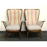 A pair of Ercol armchairs, with contemporary upholstery.
