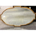 A 1920's oak framed bevelled mirror, 41 x 71 cm.