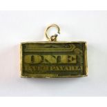 A 9ct yellow gold rare One Silver Payable note charm.