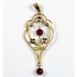 An Edwardian 9ct yellow gold (stamped 9ct) pendant set with seed pearls and tourmalines.