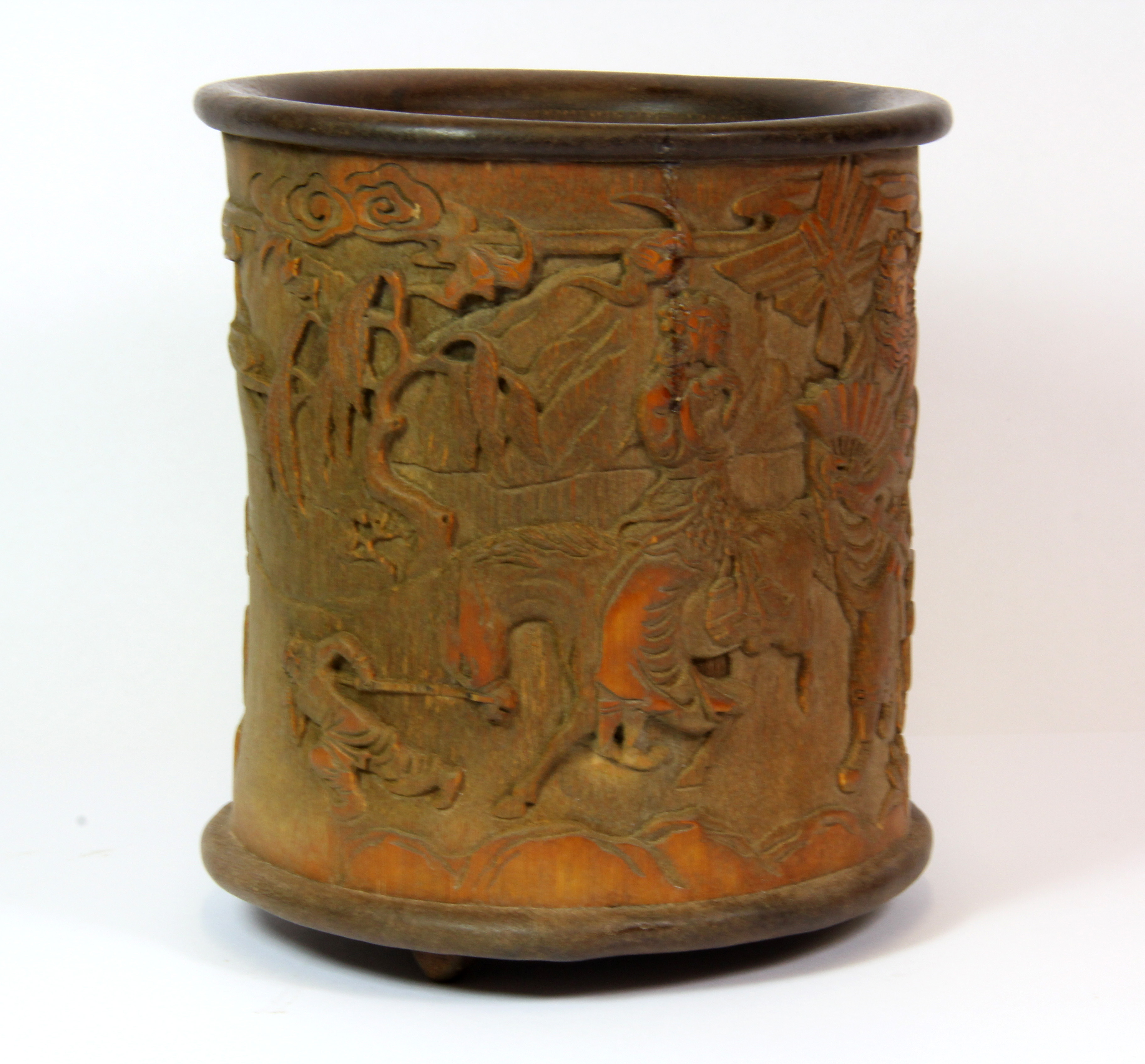 A Chinese carved bamboo brush pot with detailed decoration, H. 16cm, Dia. 14cm.