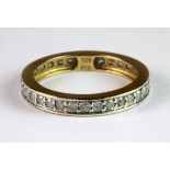 A 9ct yellow gold (stamped 375) diamond set full eternity ring.