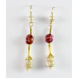 A pair of antique yellow metal (tested 14ct gold) drop earrings set with tourmalines and pearls,