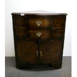 A pretty Georgian walnut bow fronted corner cabinet of two small drawers over two doors, W. 63 H.