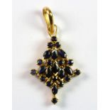 A yellow metal (tested 18ct gold) sapphire set pendant, L. 3.8cm.