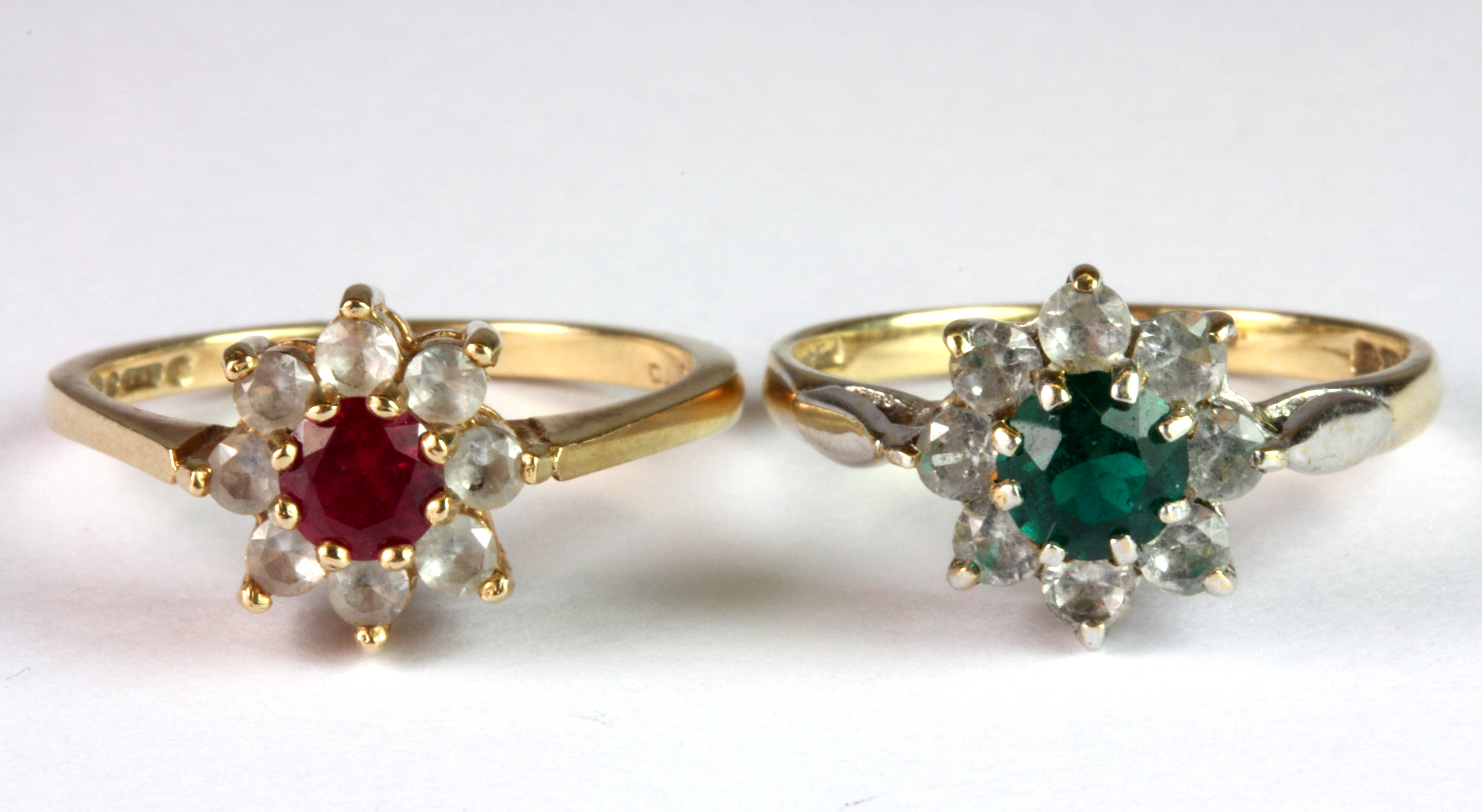 Two 9ct yellow gold stone set cluster rings (N.5 & O).