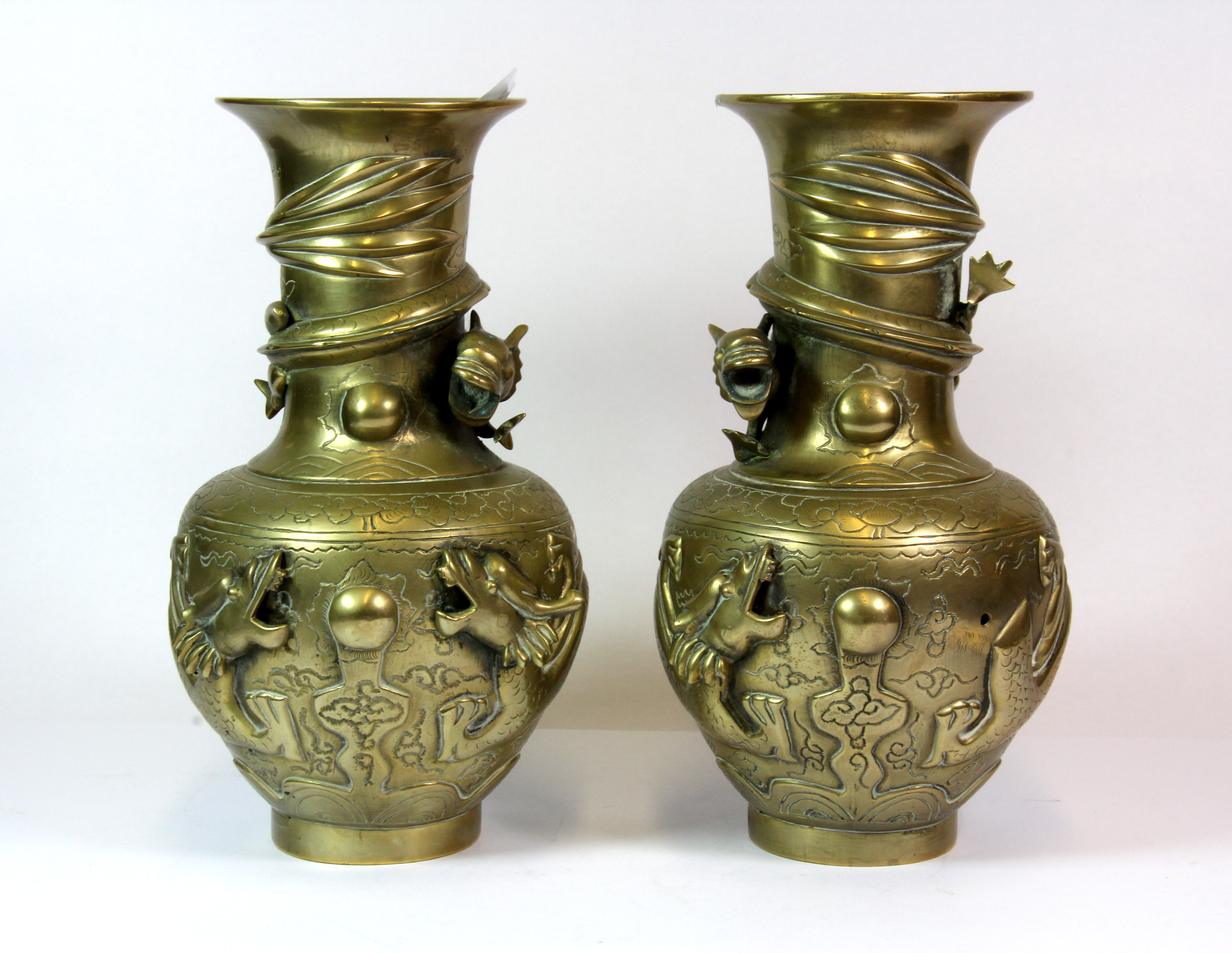 A pair of early 20th century brass / bronze dragon vases, H. 24cm.