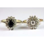 Two 9ct yellow gold stone set cluster rings (Q & O).