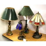 A group of four table lamps.