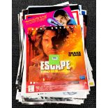 A large quantity of cinema advertising posters.