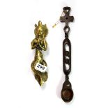 An unusual Eastern brass mermaid door handle, L. 21cm and an Eastern puzzle spoon.