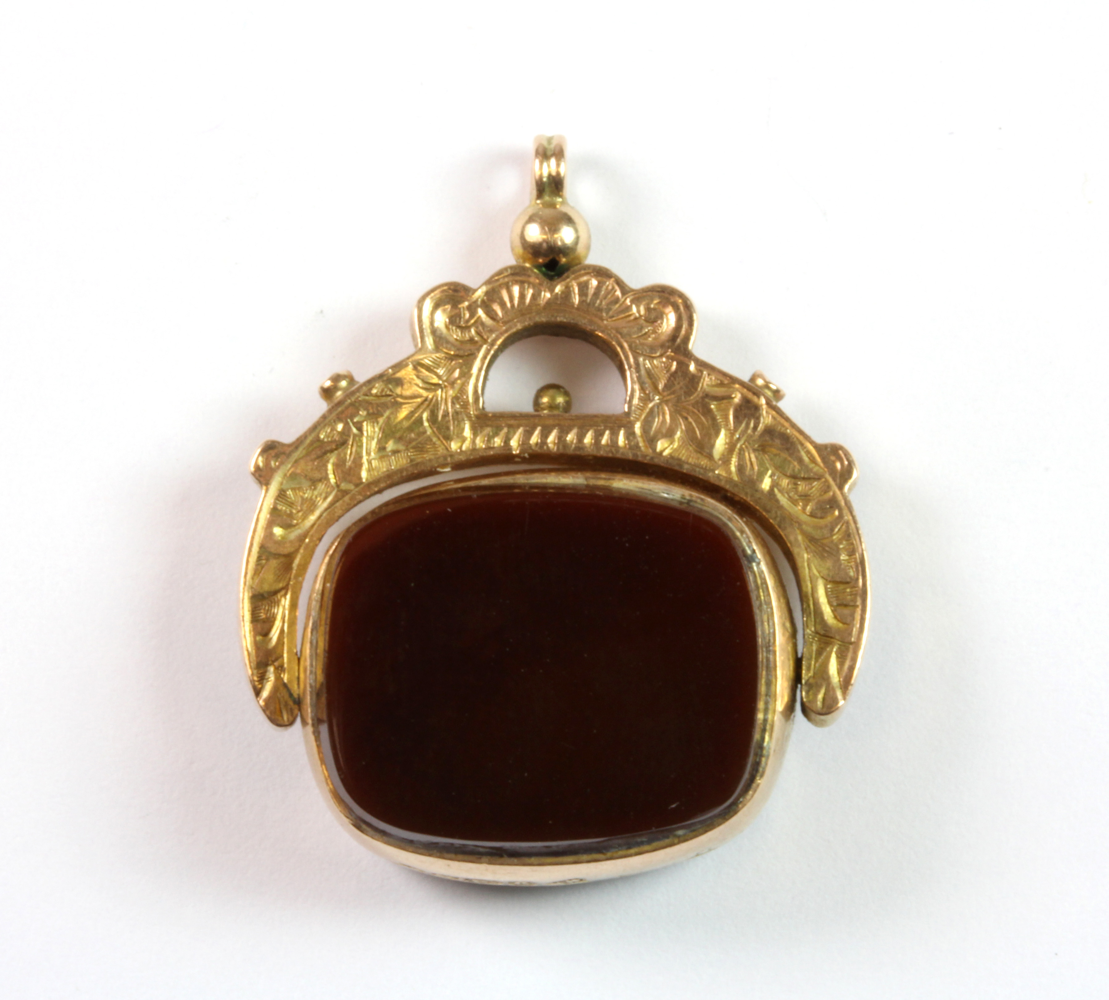A 9ct gold bloodstone and cornelian set spinning fob.