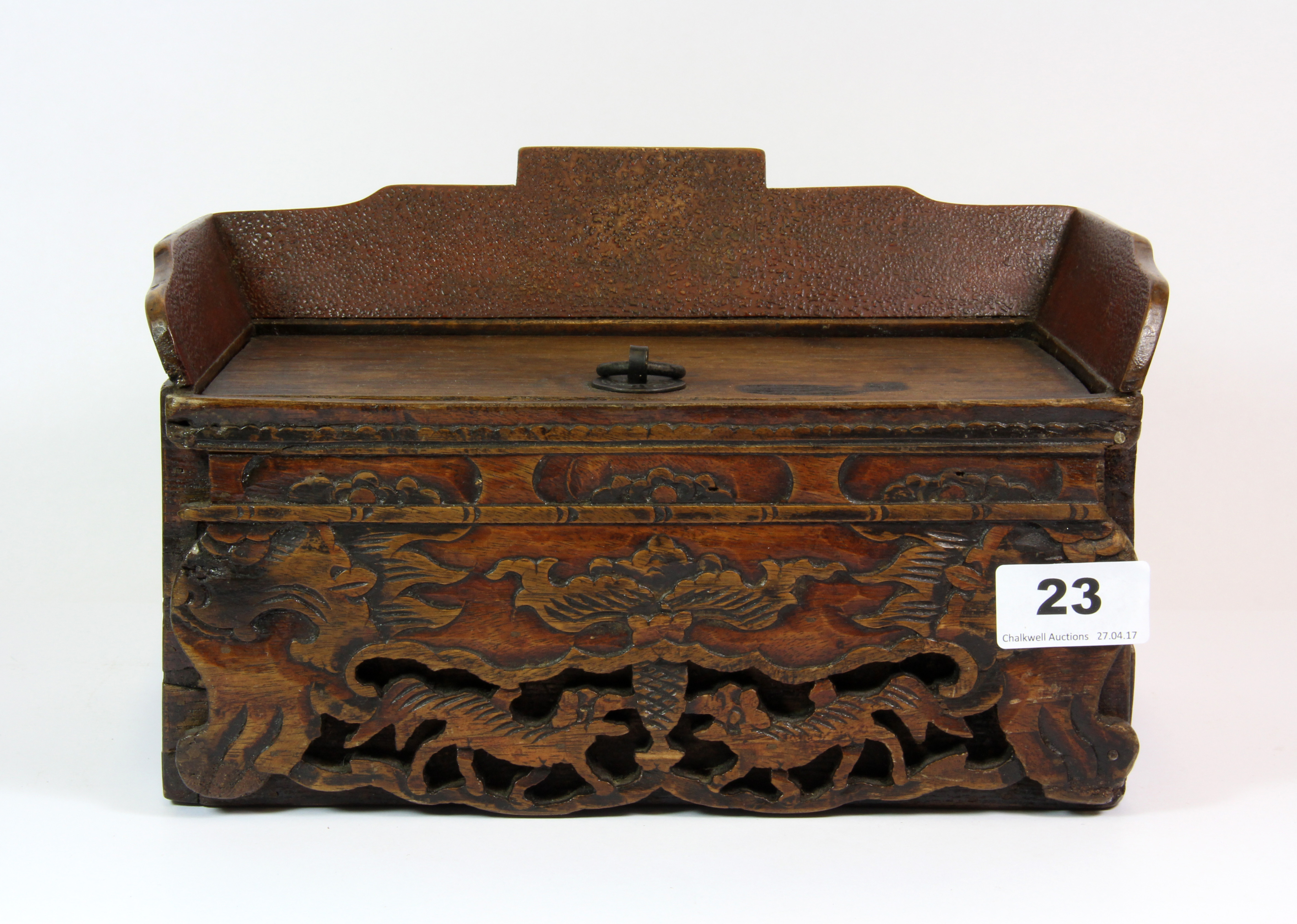 A 19th century Chinese carved wooden desk stand in the form of a throne, 25cm x 15cm x 15cm.