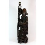 A large early 20th century Chinese carved hardwood figure of Shoo Lao, mounted as a table lamp, H.