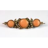 An Edwardian rose metal (tested minimum 9ct gold) coral and seed pearl set bar brooch, L. 4.5cm.