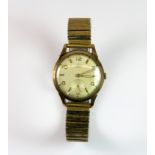 A vintage Avia 9ct gold wrist watch with a rolled gold expandable strap.