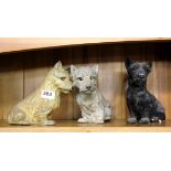 Three 19th century painted spelter figures of terrier dogs, H. 20cm.