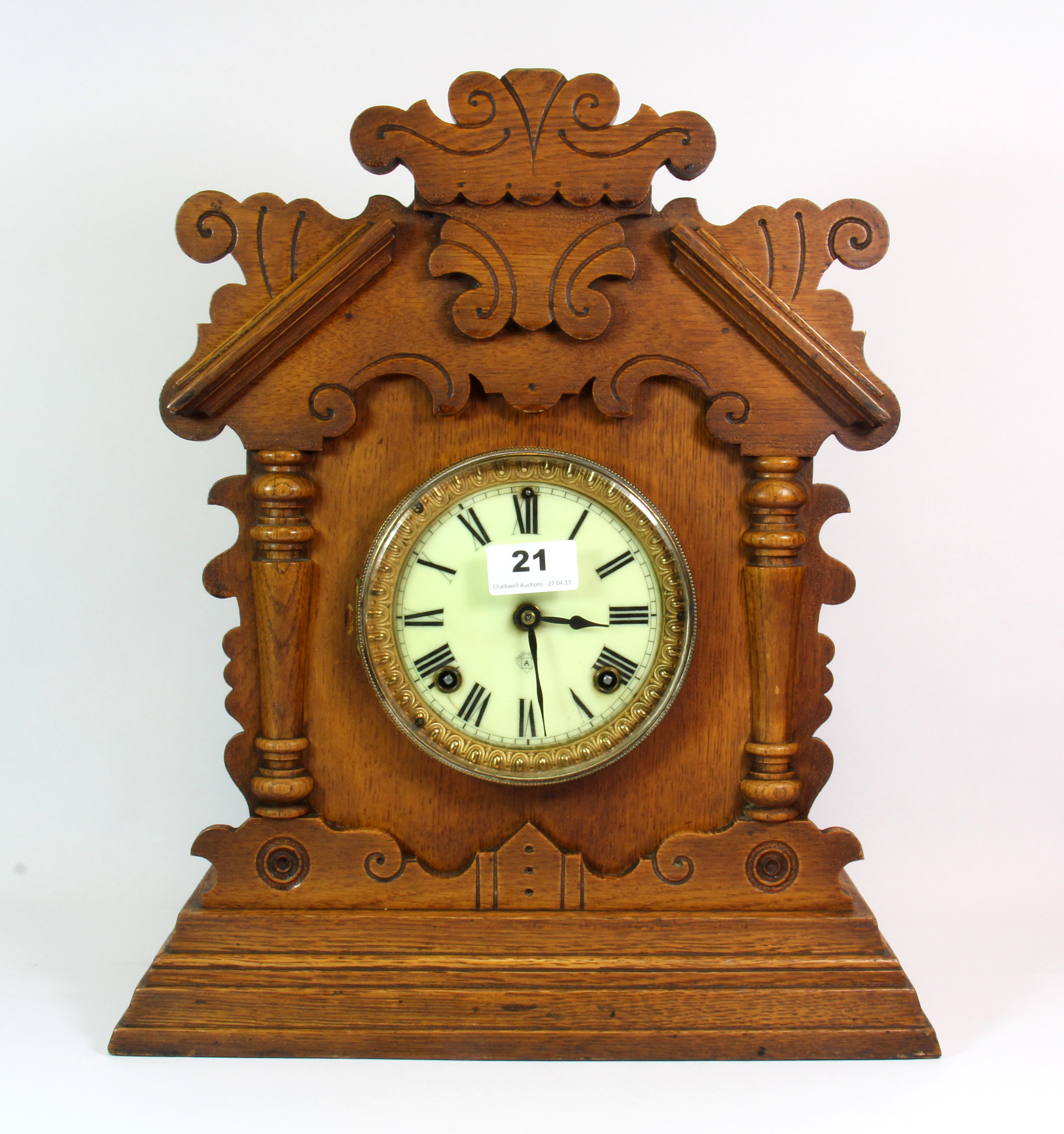 A 19th century oak mantle clock, H. 41cm, understood to be in working order.