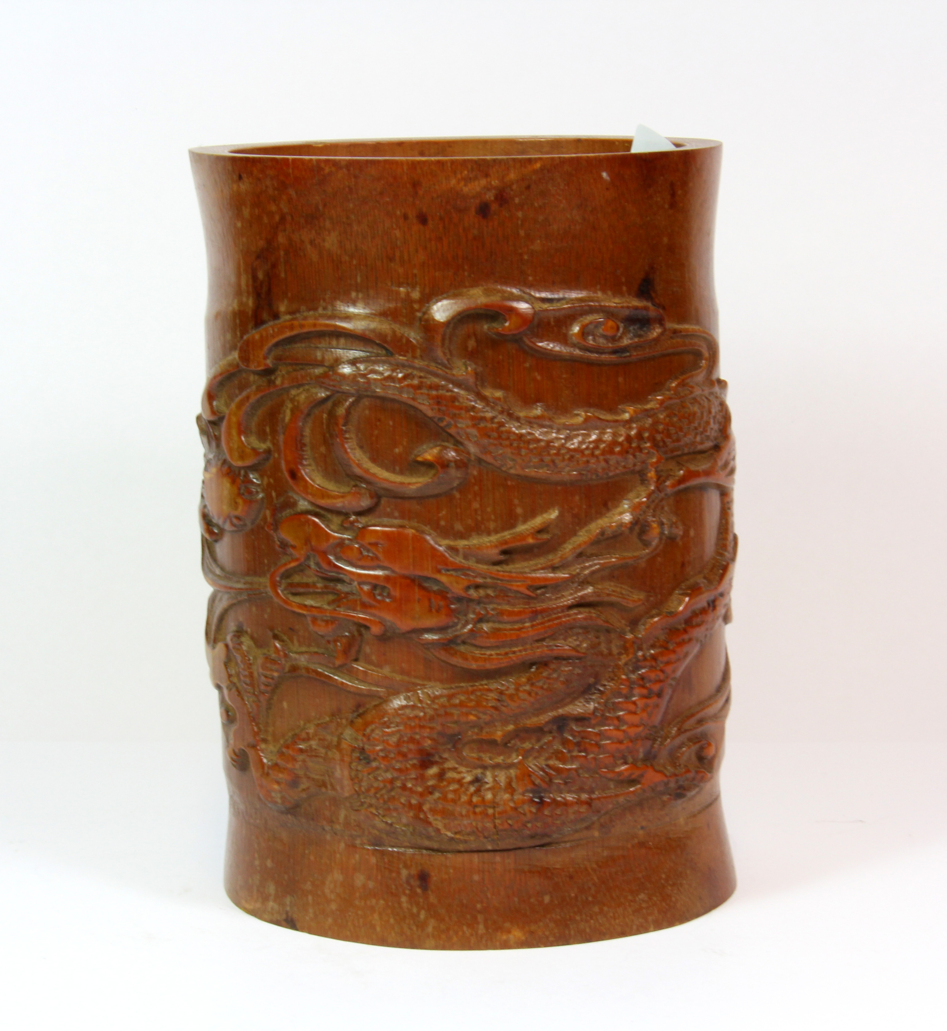 A mid 20th century Chinese carved bamboo brush pot, H. 18cm.