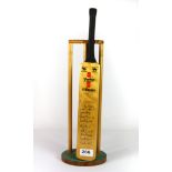 An autographed 1980 Essex County Cricket Club miniature cricket bat and wickets.