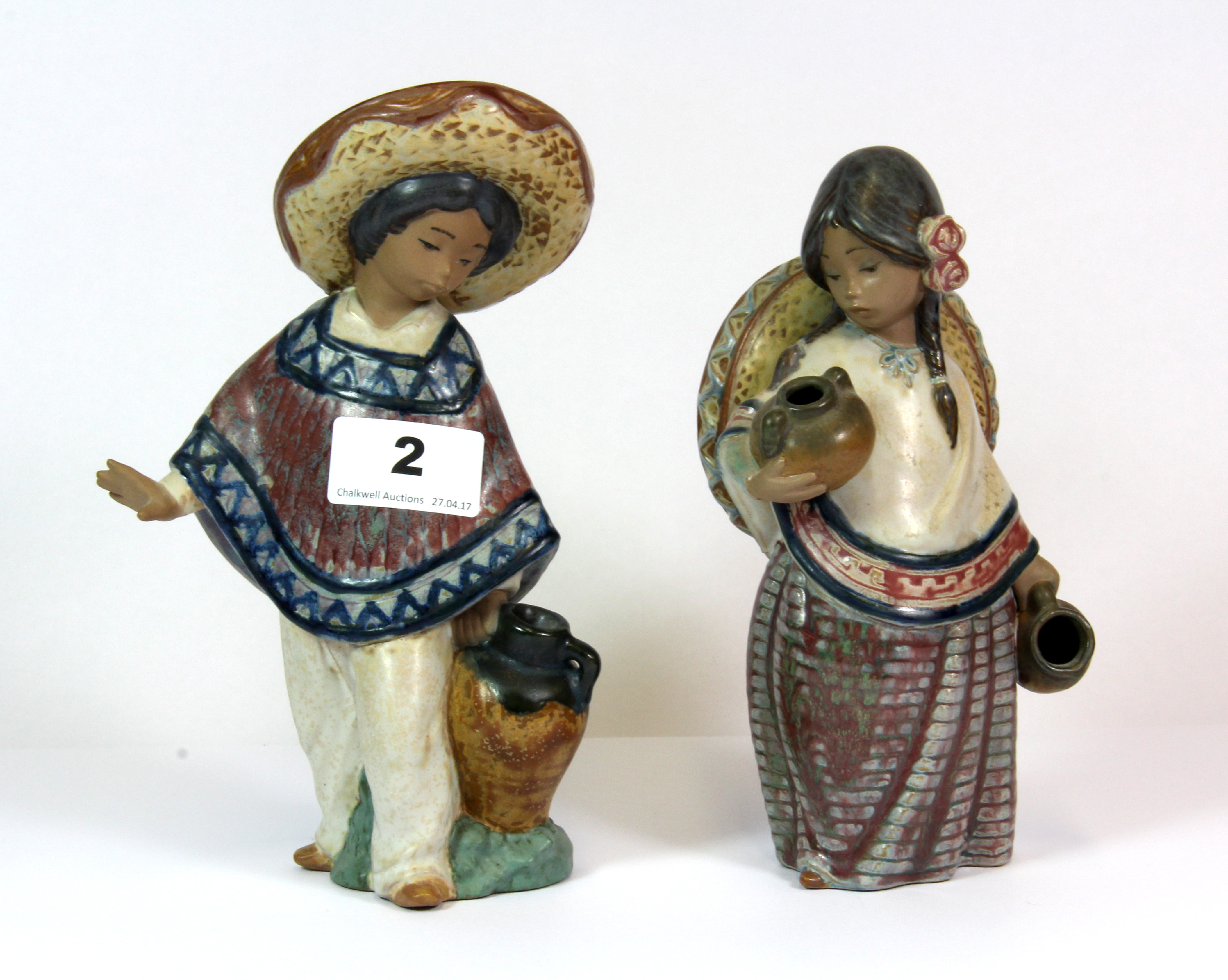 Two Lladro glazed pottery figures of Mexican children, H. 19cm.