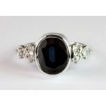 A 14ct white gold (14ct) ring set with a natural large oval cut sapphire (approx. 4.70ct) and