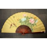 A large painted Chinese fan, L. 63cm.