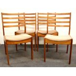 A set of four G - Plan style chairs.